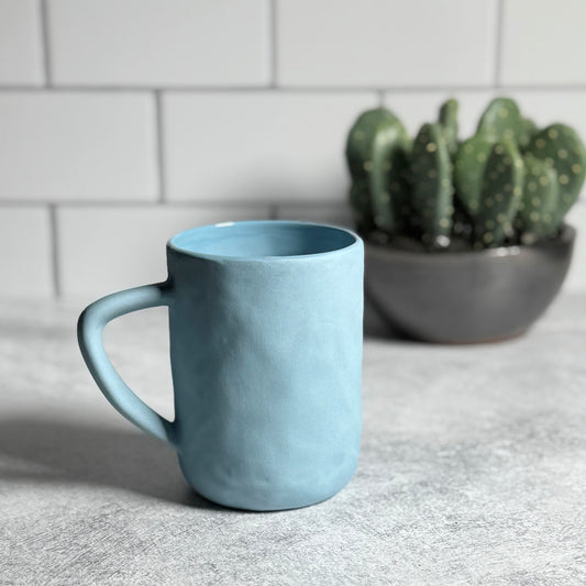 Stoneware Mug with Matte Blue Glaze and Cobblestone Texture