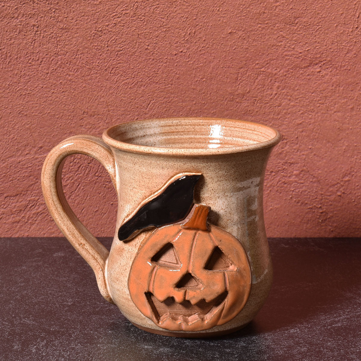 MudWorks Pottery Raven with Carved Pumpkin Mug, Sandstone