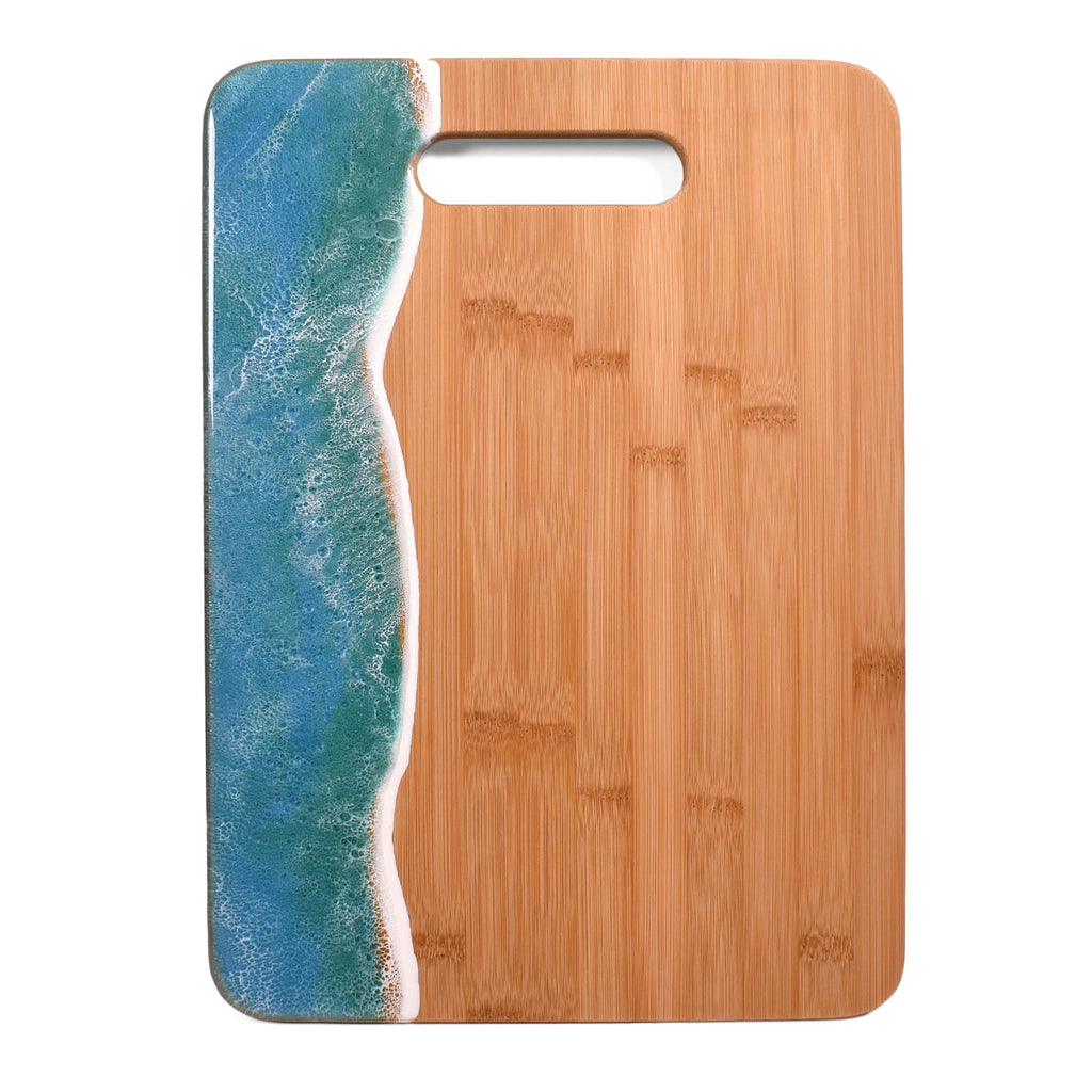 http://thebarringtongarage.com/cdn/shop/products/OceanWaveBambooCuttingBoardMermaidTail-1_1024x1024.jpg?v=1665697359