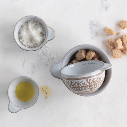 Creative Co-Op 4-piece Stoneware Measuring Cup Set with White Wax Relief Patterns