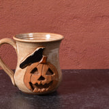 MudWorks Pottery Raven with Carved Pumpkin Mug, Sandstone